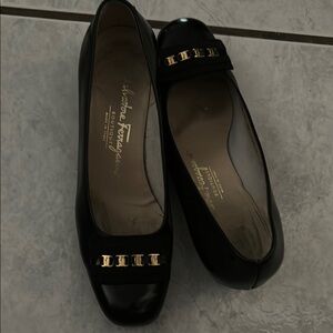 Salvatore Ferragamo Black and Gold Flats